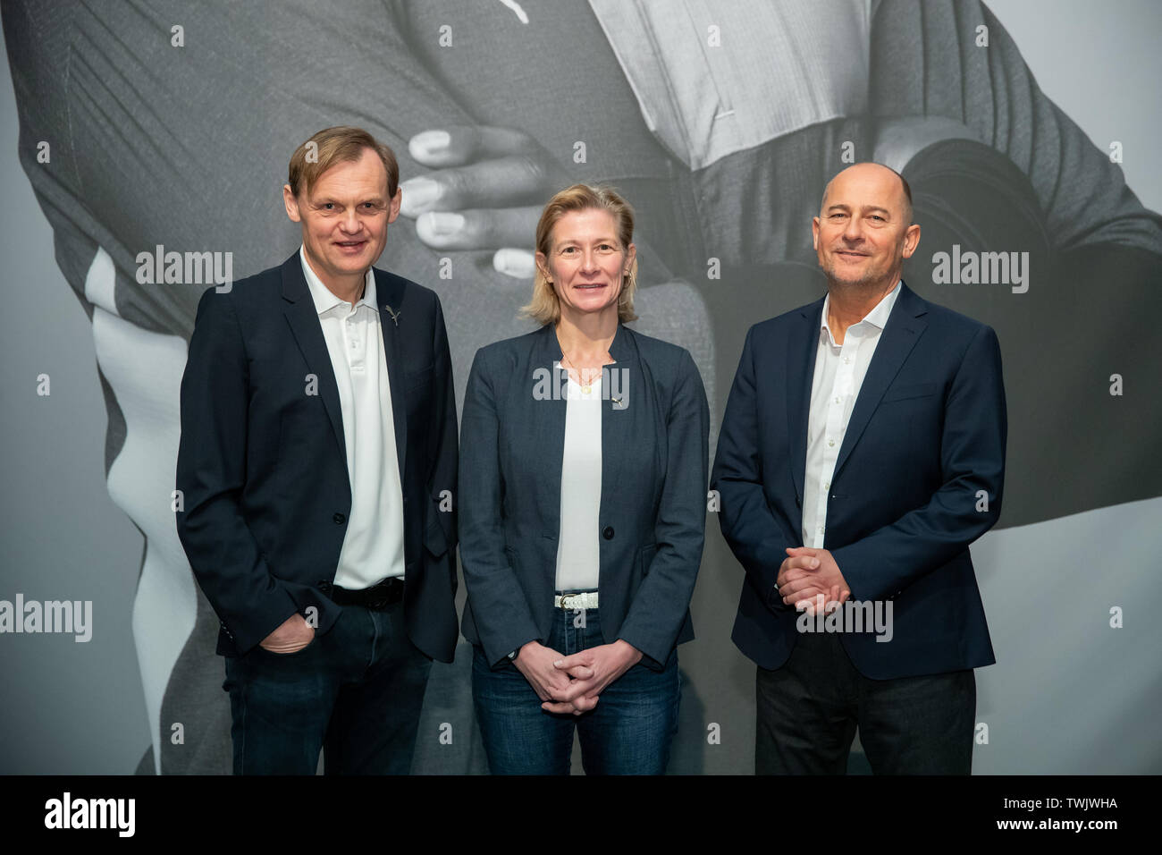 Herzogenaurach, Germany. 18th Apr, 2019. Björn Gulden (l-r), Chairman Managing Director of the sporting goods manufacturer Puma SE, Anne-Laure Descours, Chief Procurement Officer at Puma, and Michael Lämmermann, Chief Financial Officer of Puma, taken on the sidelines of the company's Annual General Meeting. Credit: Daniel Karmann/dpa/Alamy Live News Stock Photo