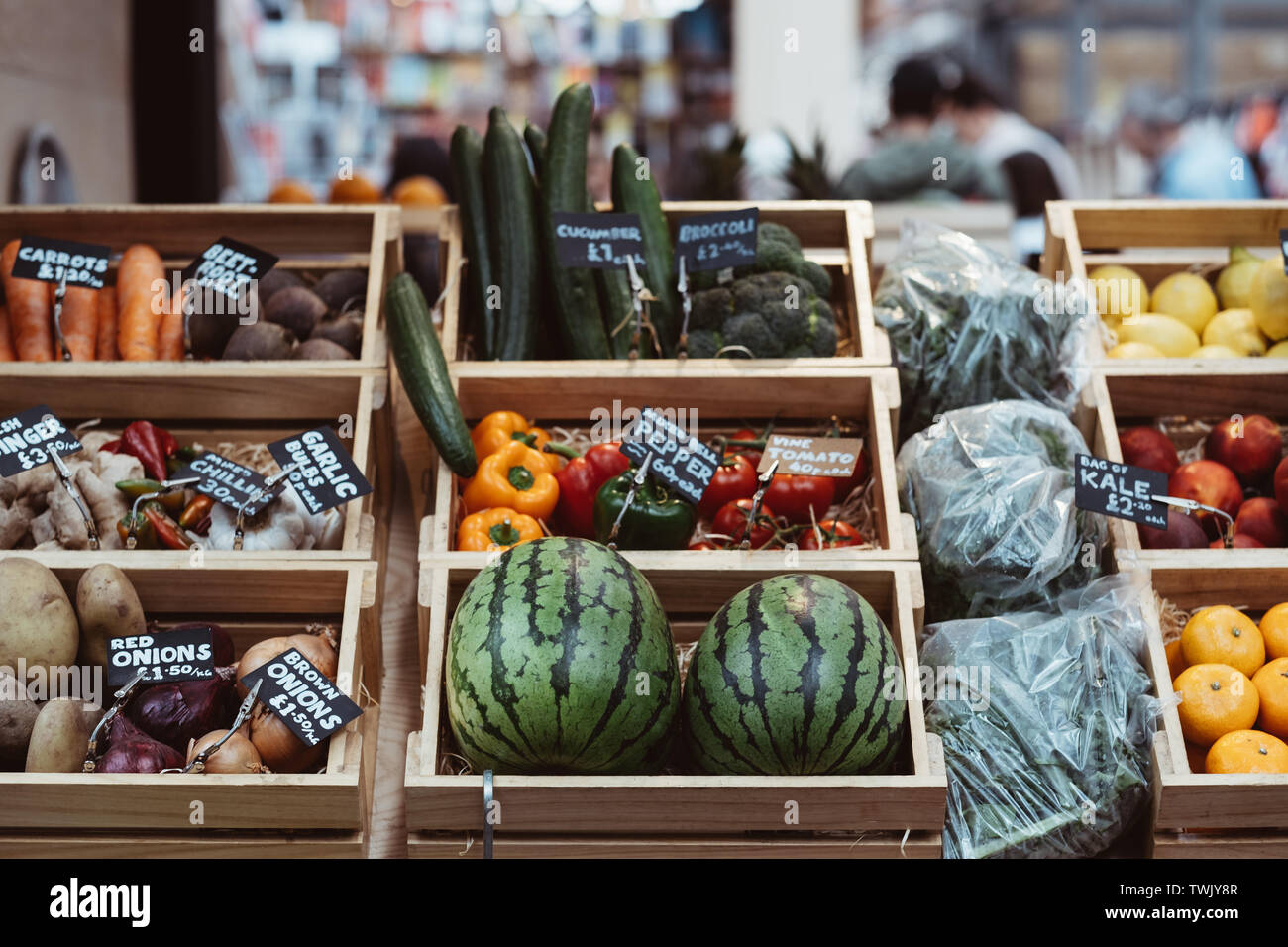 Variety of fresh fruit and vegetables in wooden crates, on sale at a ...