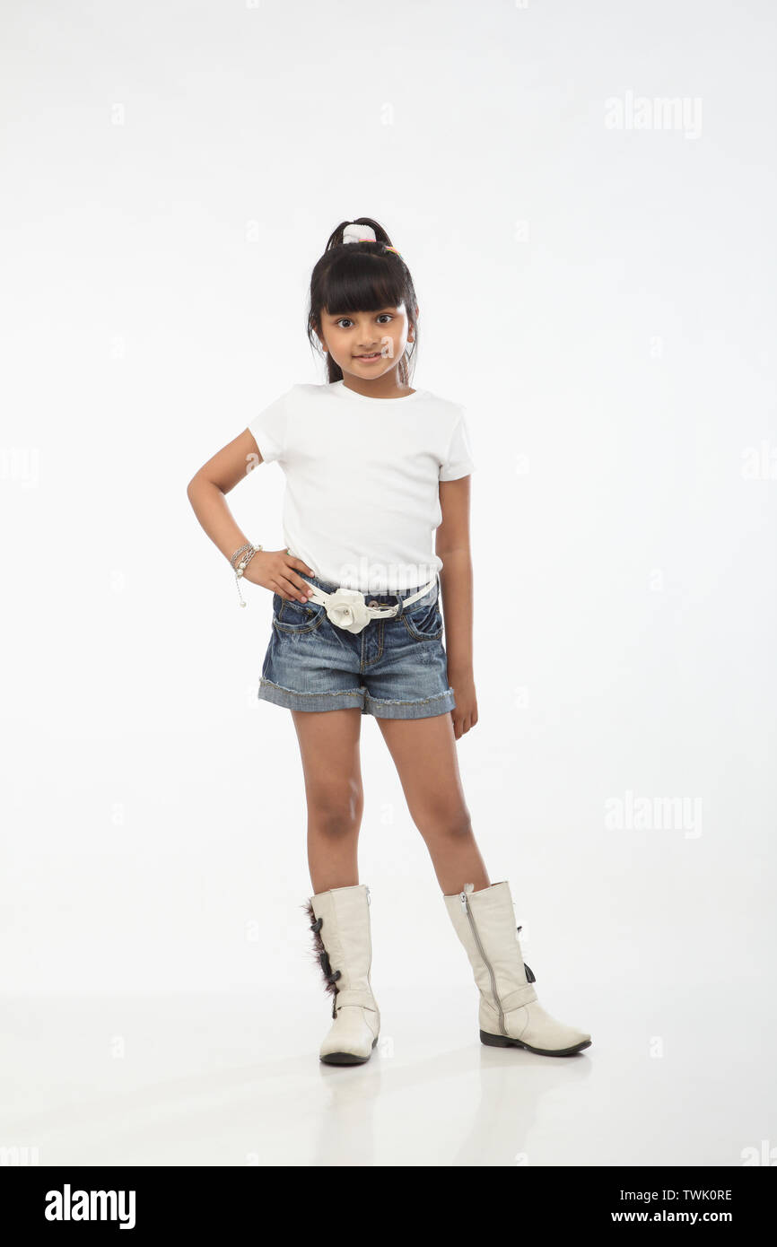 Portrait of a girl standing with hand on hip Stock Photo - Alamy