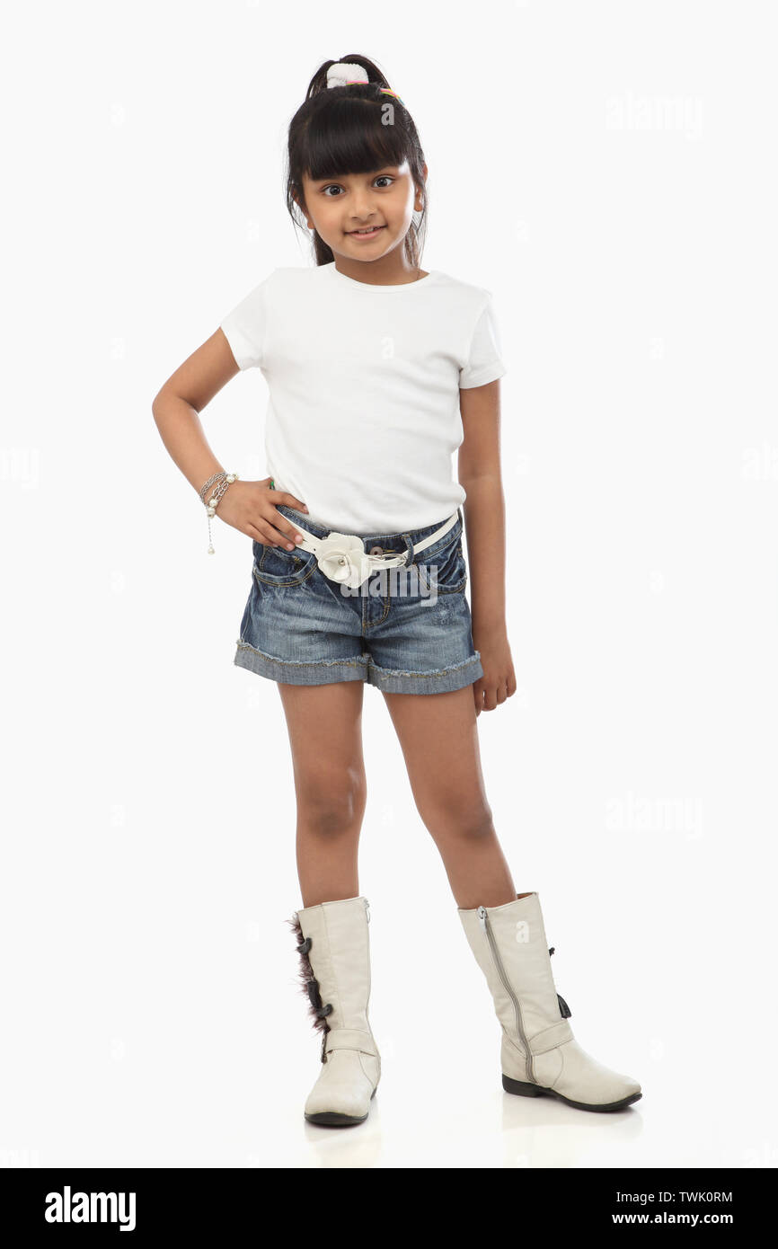 Portrait of a girl standing with her hand on hip Stock Photo - Alamy