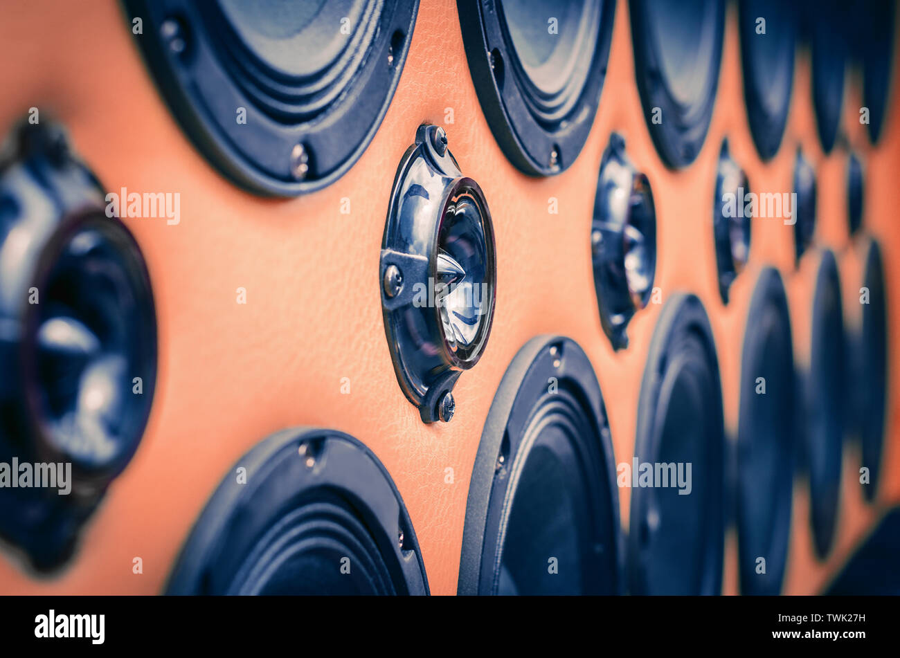 Perspective View of Rows of Sound Speakers on Light Warm Orange