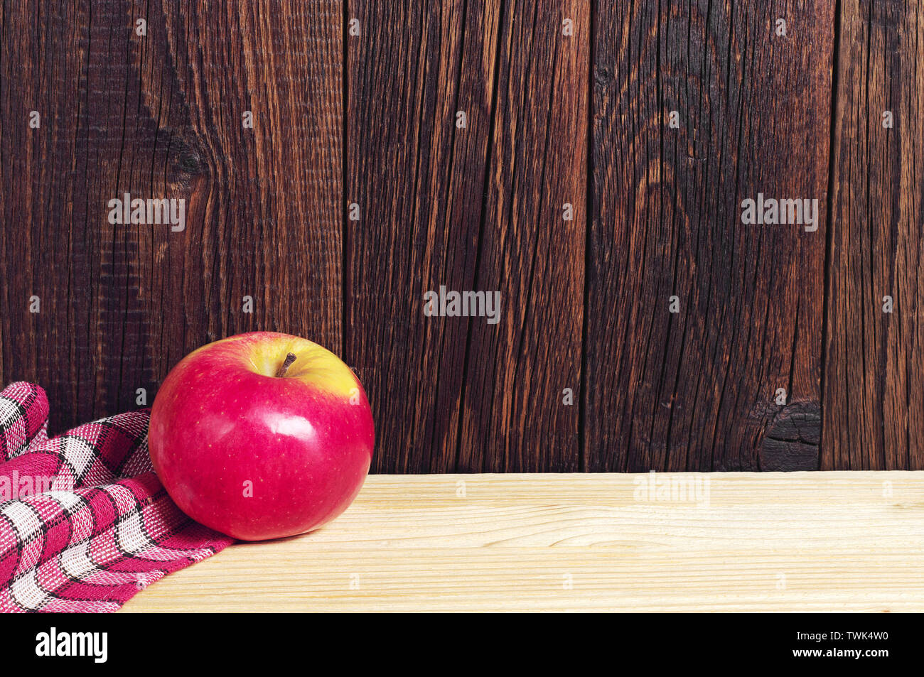 One red apple on wooden table Stock Photo
