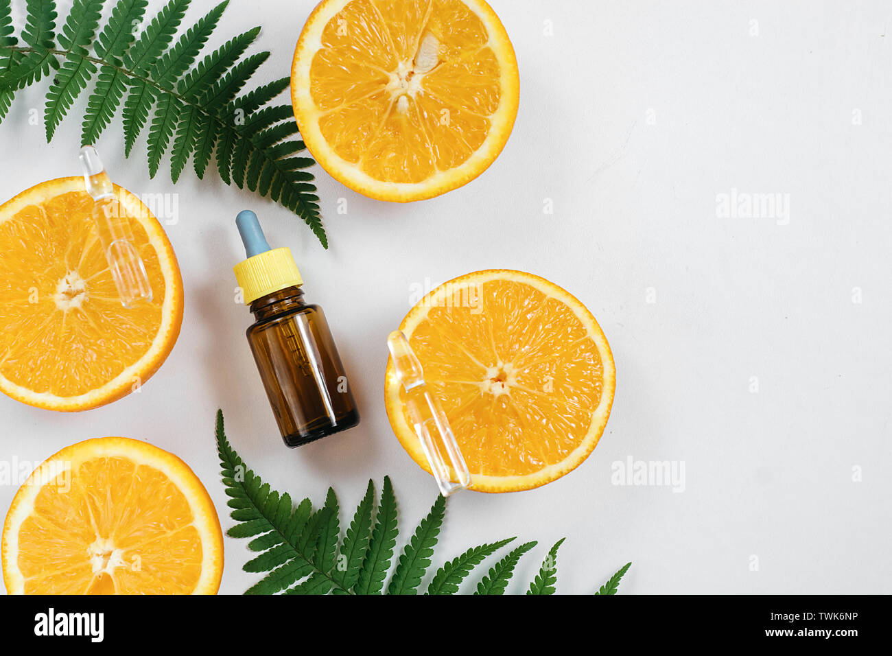 Citrus fruit essential oil, vitamin c serum, beauty care aroma therapy. Organic Spa Cosmetic With Herbal Ingredients Toning. High dose vitamin c synth Stock Photo