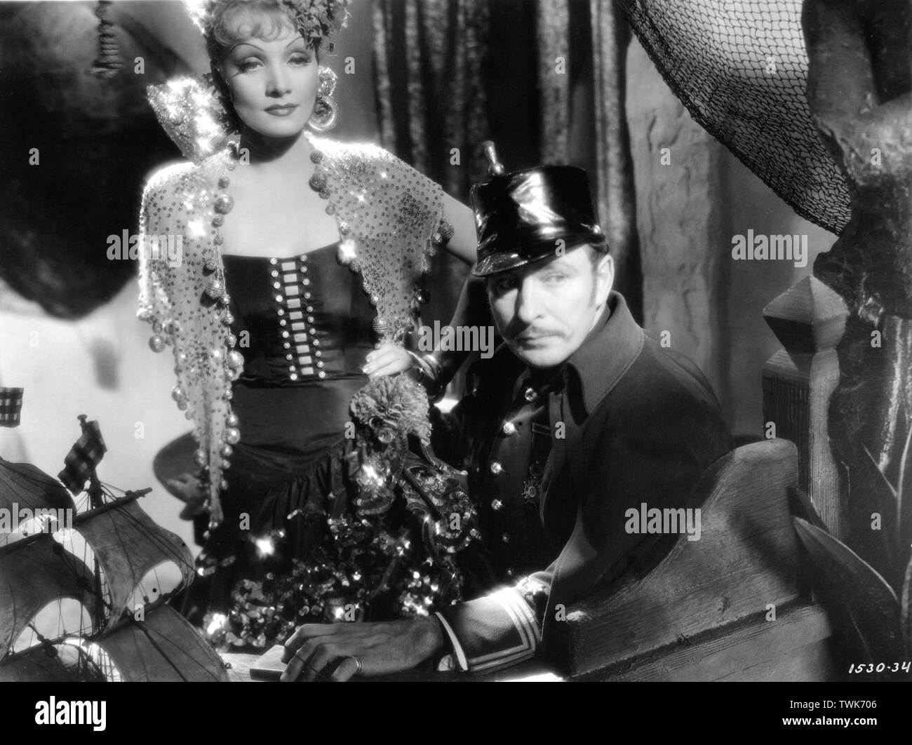 MARLENE DIETRICH as Concha Perez LIONEL ATWILL in THE DEVIL IS A WOMAN 1935  director Josef von STERNBERG costume by TRAVIS BANTON photo DON ENGLISH  Paramount Pictures Stock Photo - Alamy