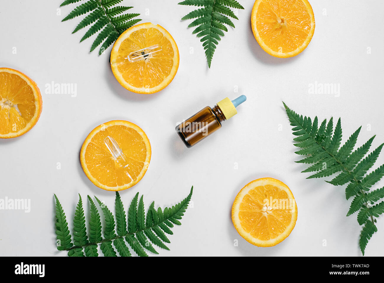 Citrus fruit essential oil, vitamin c serum, beauty care aroma therapy. Organic Spa Cosmetic With Herbal Ingredients Toning. High dose vitamin c synth Stock Photo