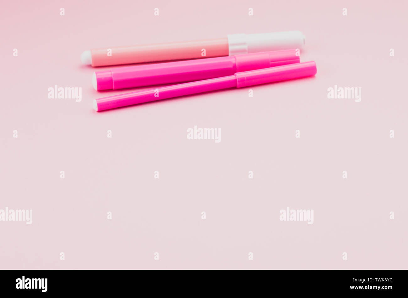 felt tip pen colored pencils on a pink surface - copy space Stock Photo ...