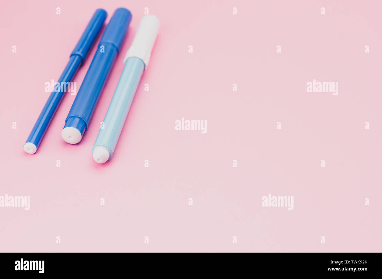 felt tip pen colored pencils on a pink surface - copy space Stock Photo ...