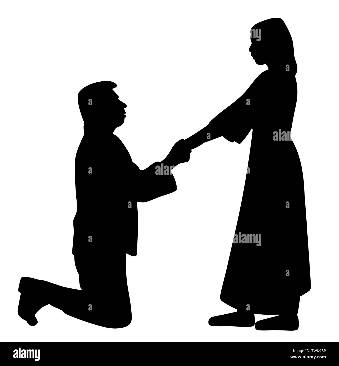 Man on knees holding hands of a woman and asking her to marry Stock Photo