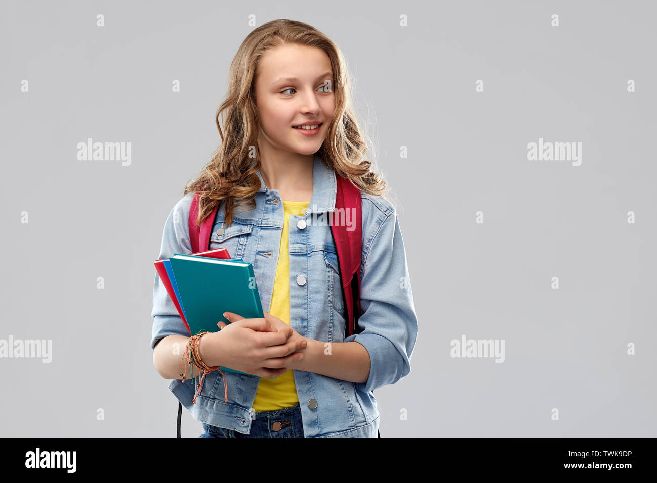 happy smiling teenage student girl with school bag Stock Photo - Alamy