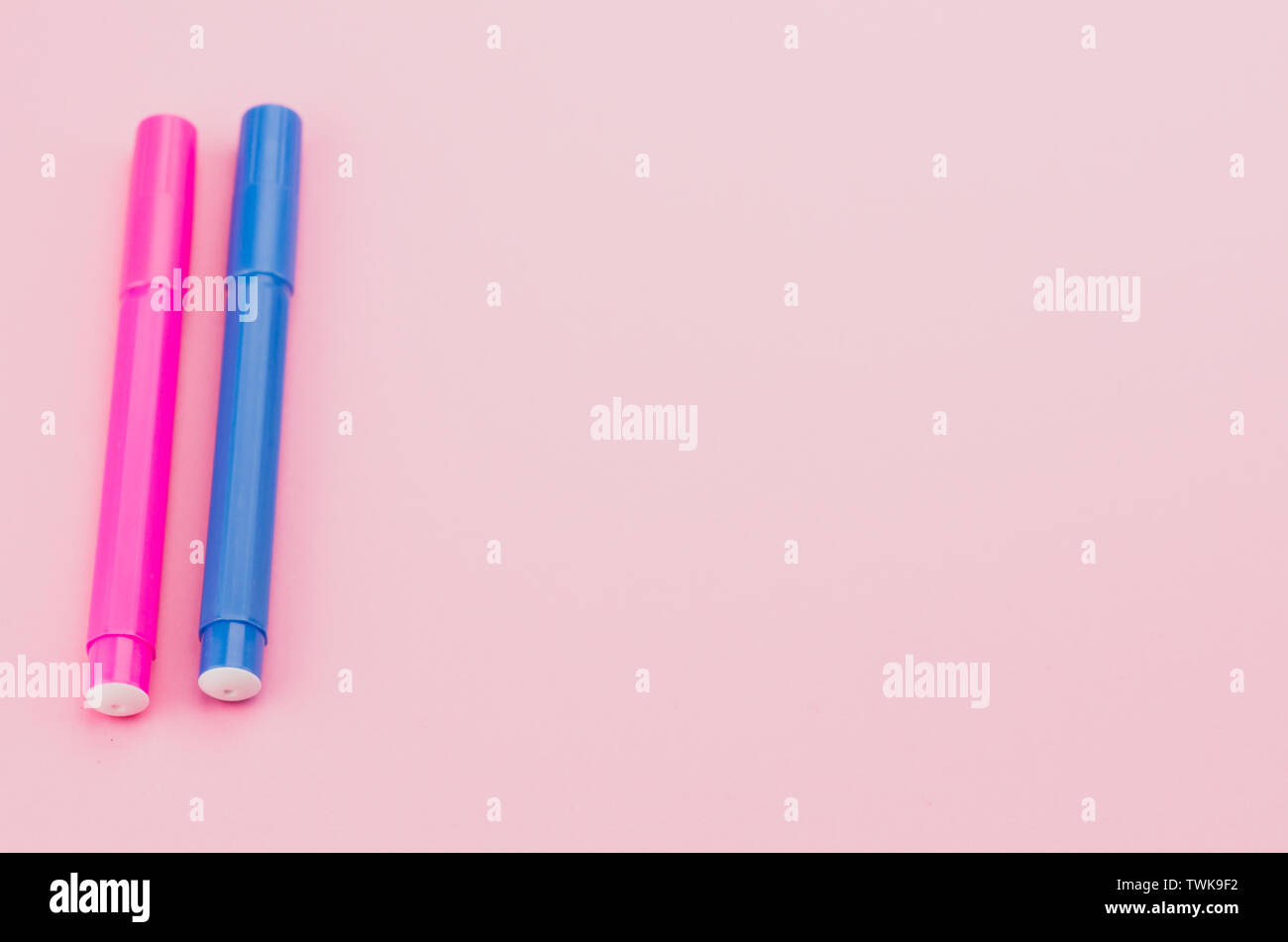 felt tip pen colored pencils on a pink surface - copy space Stock Photo ...