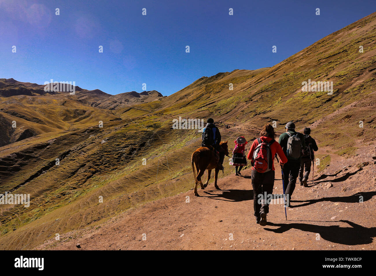 02 May 2019, Peru, Cusco: Toursites on the ascent to the Rainbow Montain. The Vinicunca, or the Rainbowmontain with an altitude of 5200 meters above zero, is located in the south of Peru and is increasingly developing into a tourist hotspot for day trippers from nearby Cusco. Only a few years ago the mountain was covered with snow and ice. Now the seven colours attract tourists from all over the world like a magnet. The Vinicunca is in the process of losing the rank in the tourist attraction Machu Picchu. The best view of Vinicunca is from the opposite mountain at 5340 metres above sea level. Stock Photo