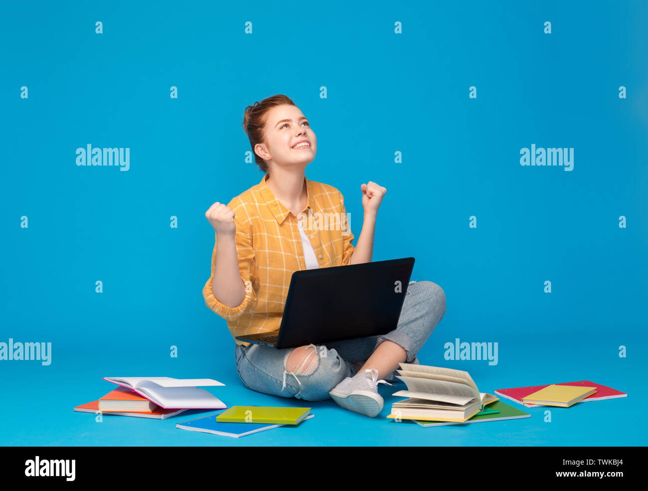 happy student girl with laptop celebrating success Stock Photo - Alamy