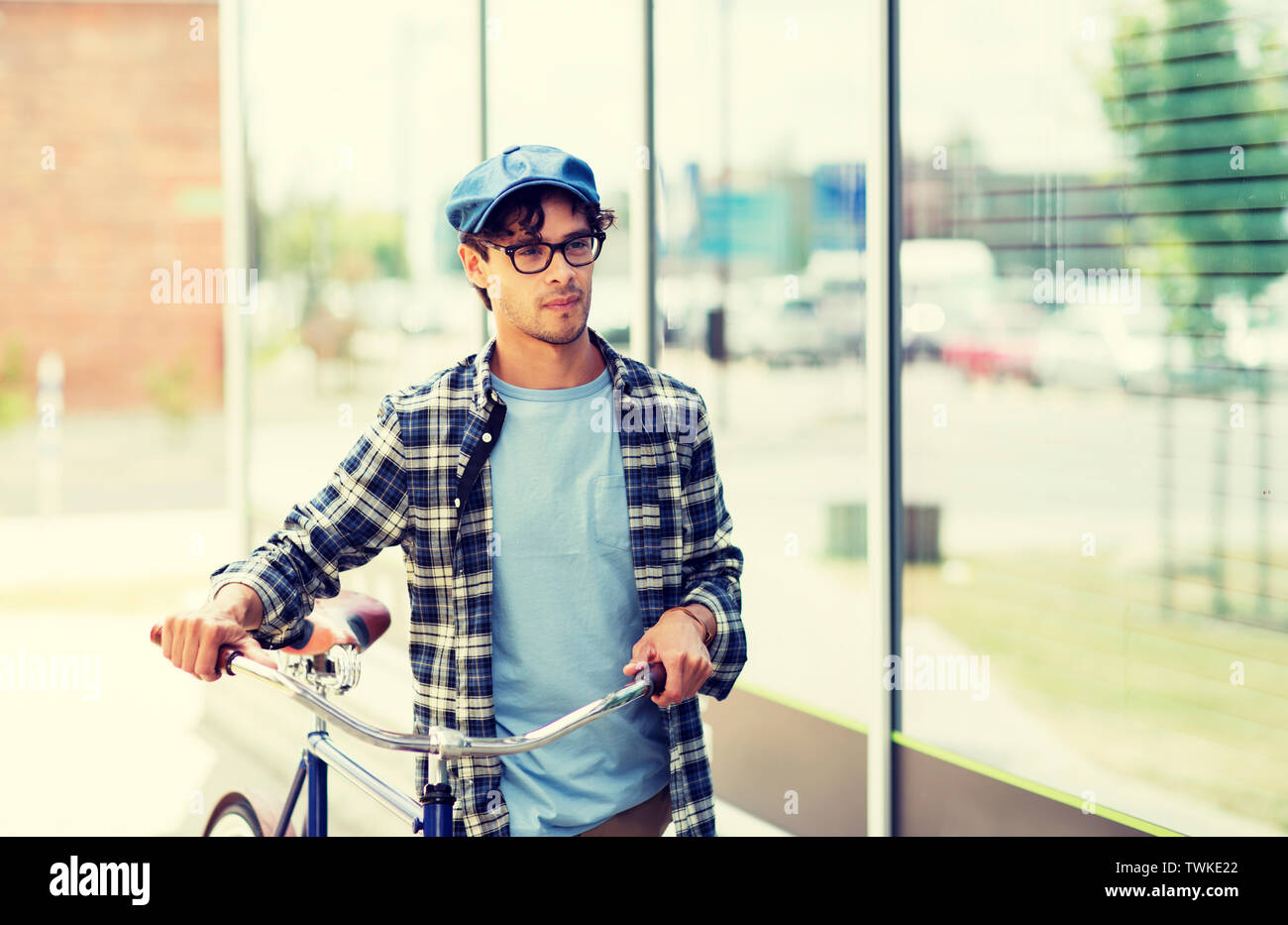 hipster man walking with fixed gear bike Stock Photo Alamy