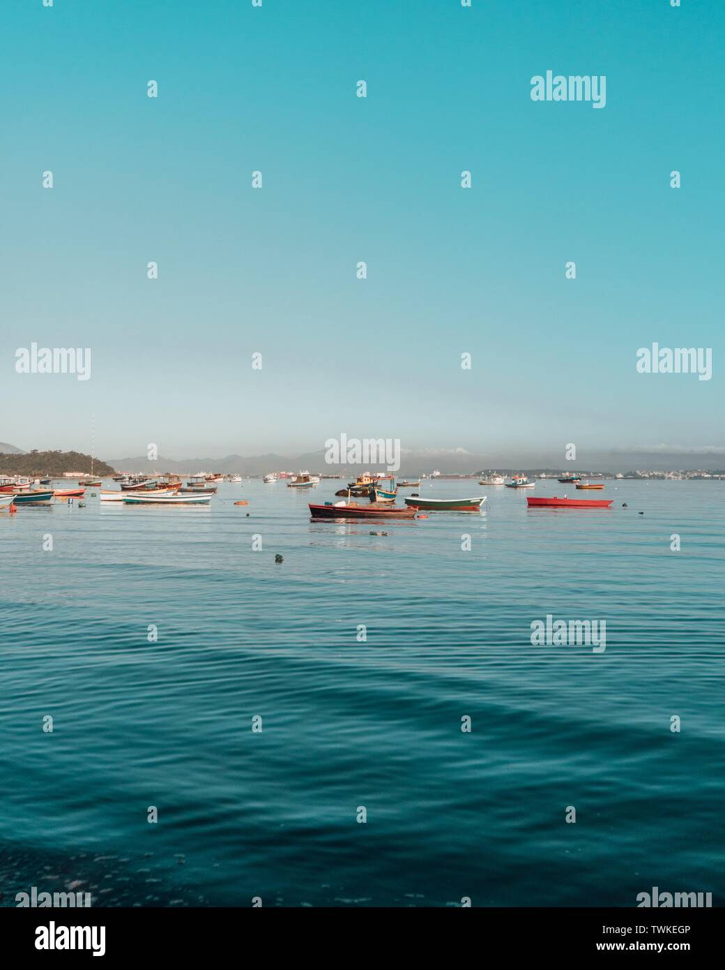 Fishing boats on the water with clear beautiful sky Stock Photo - Alamy