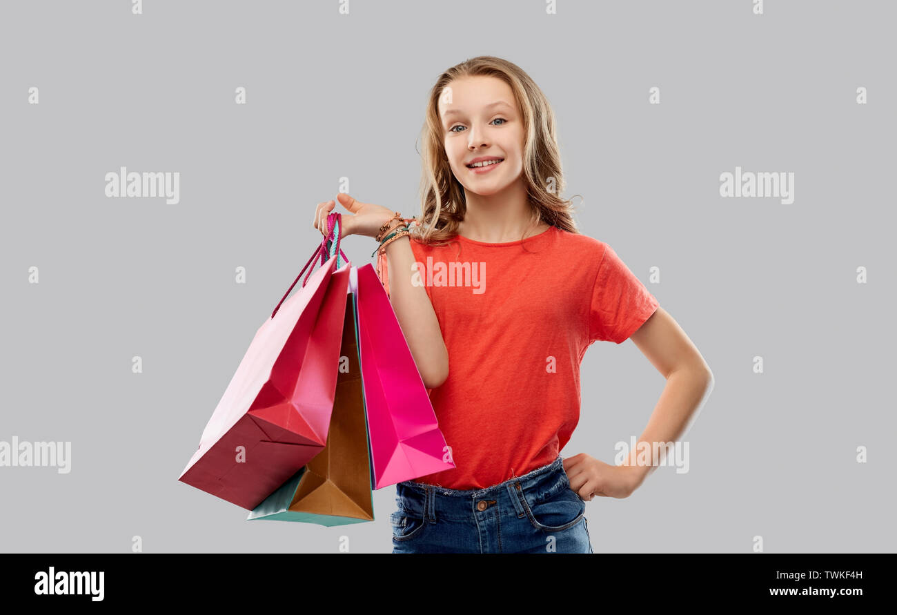 smiling teenage girl with shopping bags Stock Photo Alamy
