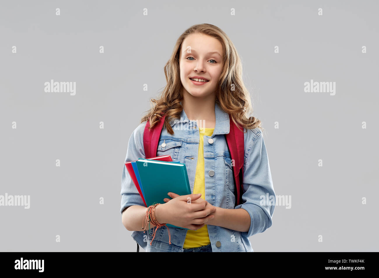happy smiling teenage student girl with school bag Stock Photo - Alamy