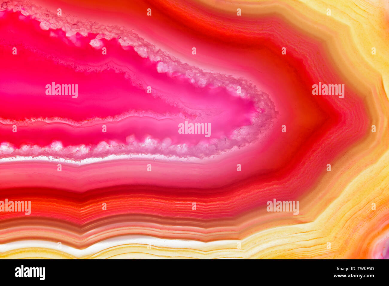 Red orange agate slice striped mineral abstract background Stock Photo