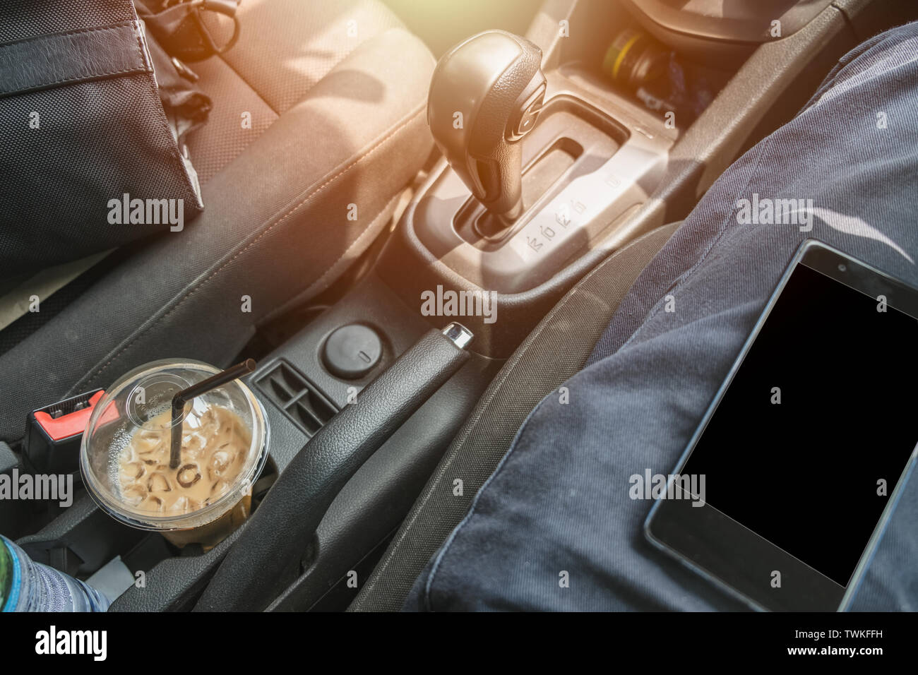 Inside car with cell phone on driver with coffee and camera bag for travel  in holidays Stock Photo - Alamy