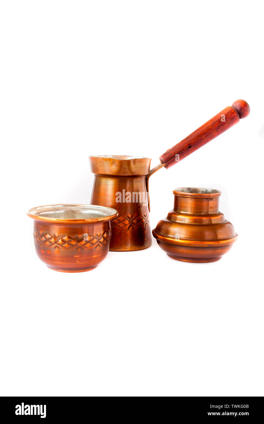 Handmade copper coffee service on a white background Stock Photo