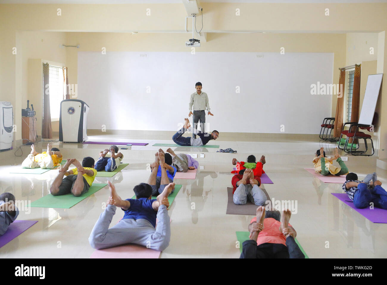 Bangalore, Karnataka, INdia. 13th Dec, 2018. 13 Dec 2018 - Bangalore, INDIA.Dr. Hemant Bhargav, Senior Scientific Officer & Principal Investigator, NIMHANS Integrated Centre for Yoga ; teaches yoga postures at the Yoga Center at NIMHANS.After various scientific Tests the NIMHANS (National Institute of Mental Health and Neuro Sciences) concluded that there are immense positive healing effects of Yoga on the body & the chanting of the word 'AUM' helps the mind attain a deep state of relaxation. Credit: Subhash Sharma/ZUMA Wire/Alamy Live News Stock Photo