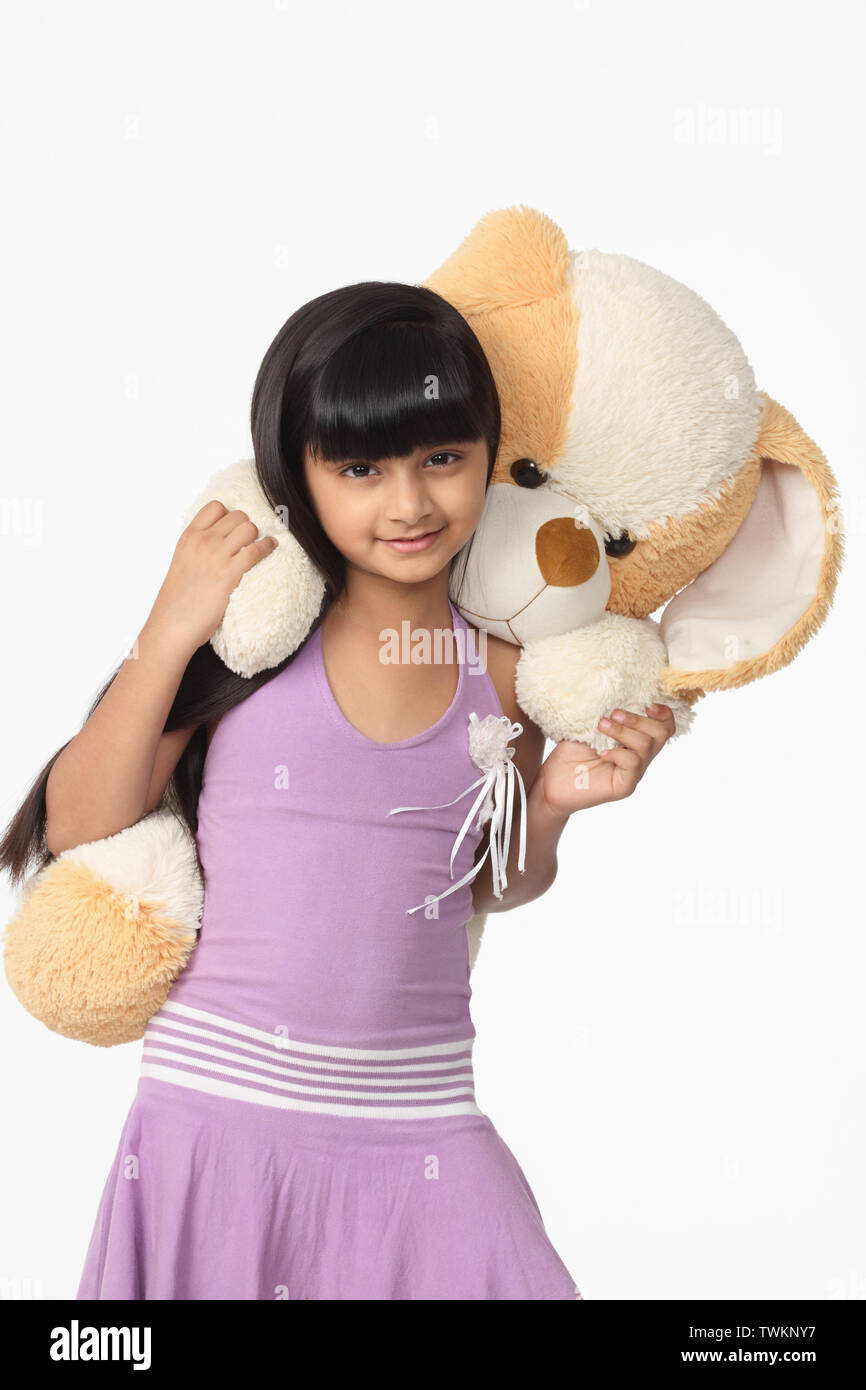 Girl playing with a toy Stock Photo - Alamy