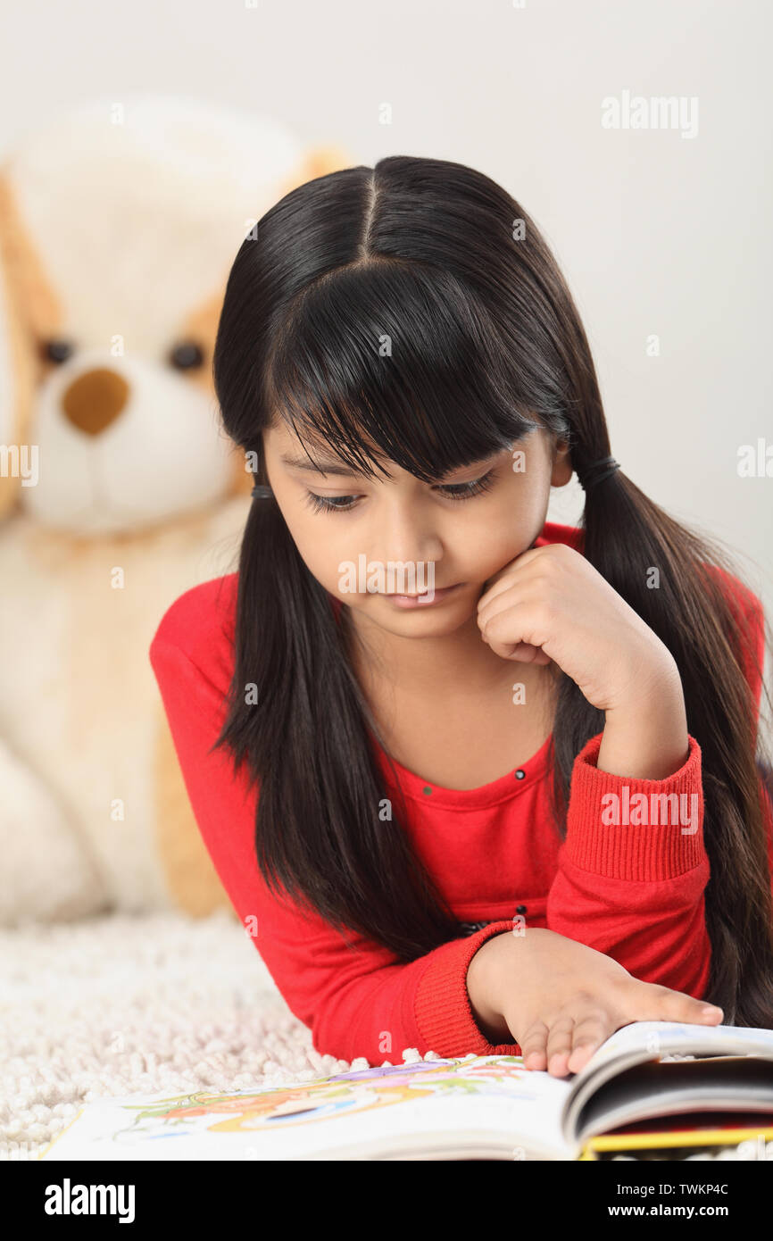 Indian girl reading a book hi-res stock photography and images - Alamy