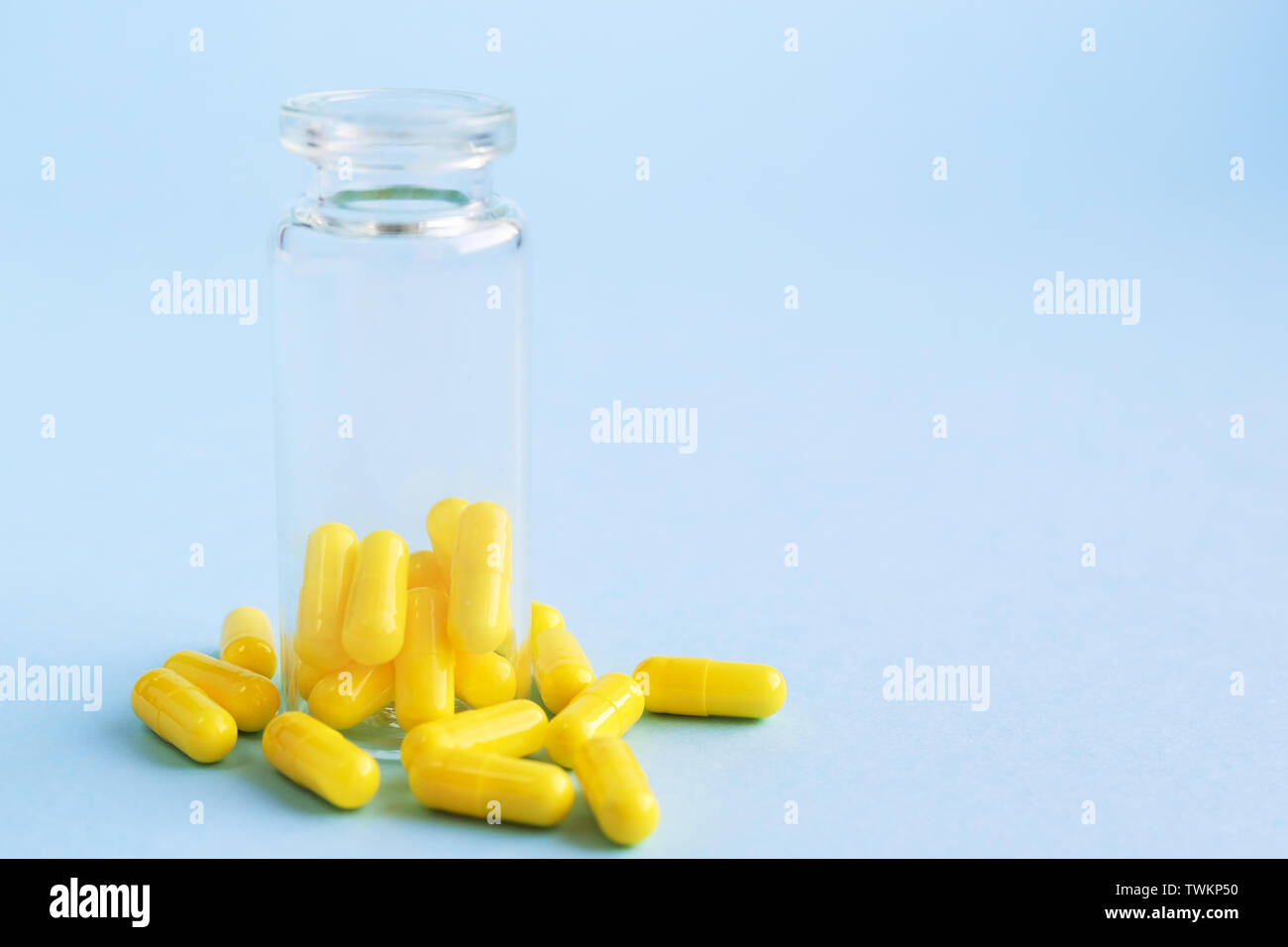 Download Yellow Capsules From Glass Bottle On Blue Background Copyspace For Text Epidemic Painkillers Healthcare Treatment Pills And Drug Abuse Concept Stock Photo Alamy Yellowimages Mockups