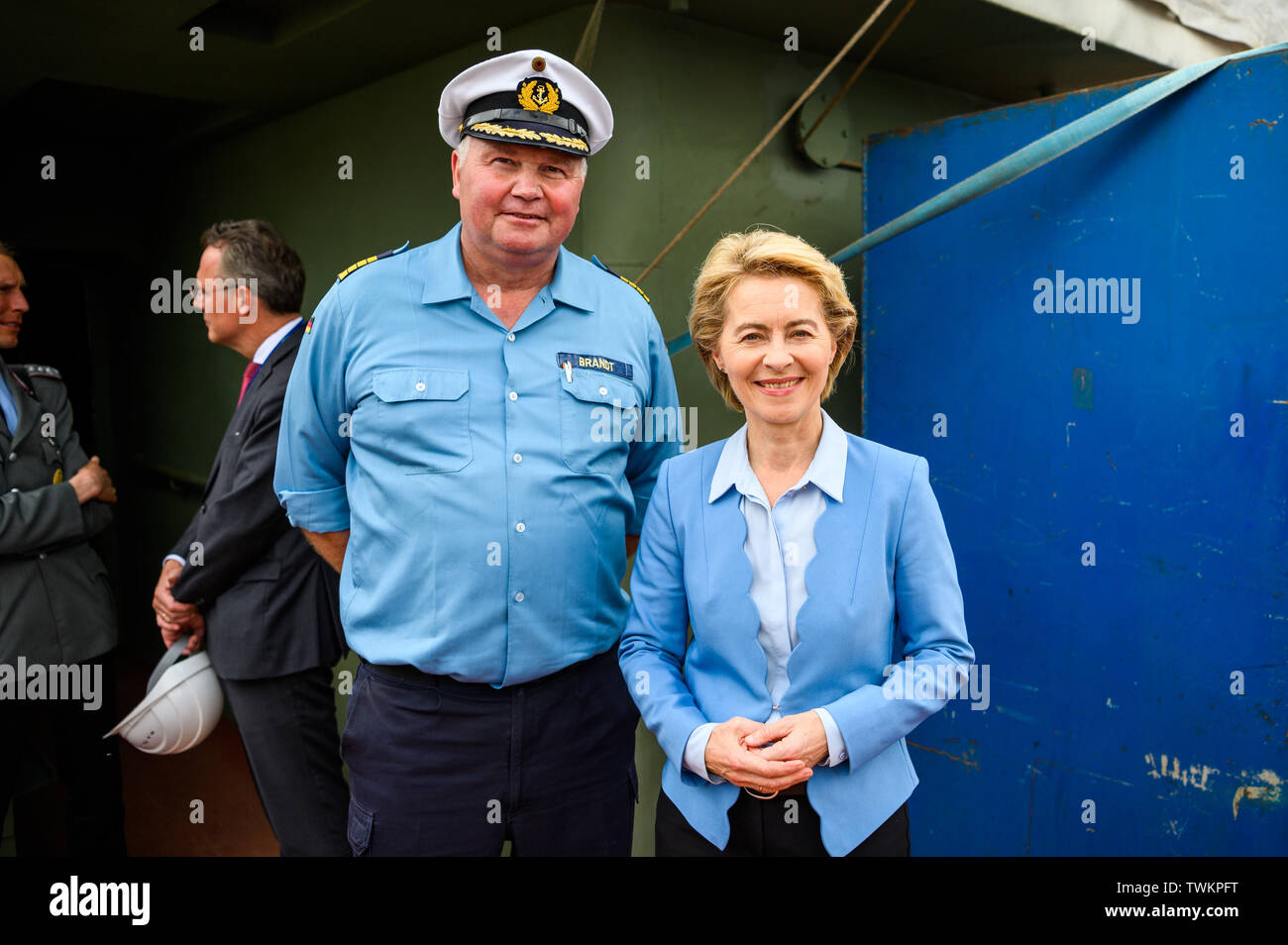 Bremerhaven, Germany. 21st June, 2019. Ursula von der Leyen (CDU), Minister of Defence, and Nils Brandt, Commander of the Gorch Fock, stand together for a photo on the naval training ship 'Gorch Fock'. The naval training ship 'Gorch Fock' was launched in Bremerhaven after more than three years in the dock again. Credit: Mohssen Assanimoghaddam/dpa/Alamy Live News Stock Photo