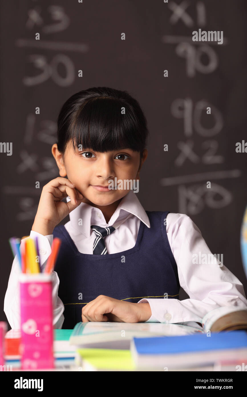 Portrait of a girl sitting in a classroom Stock Photo - Alamy