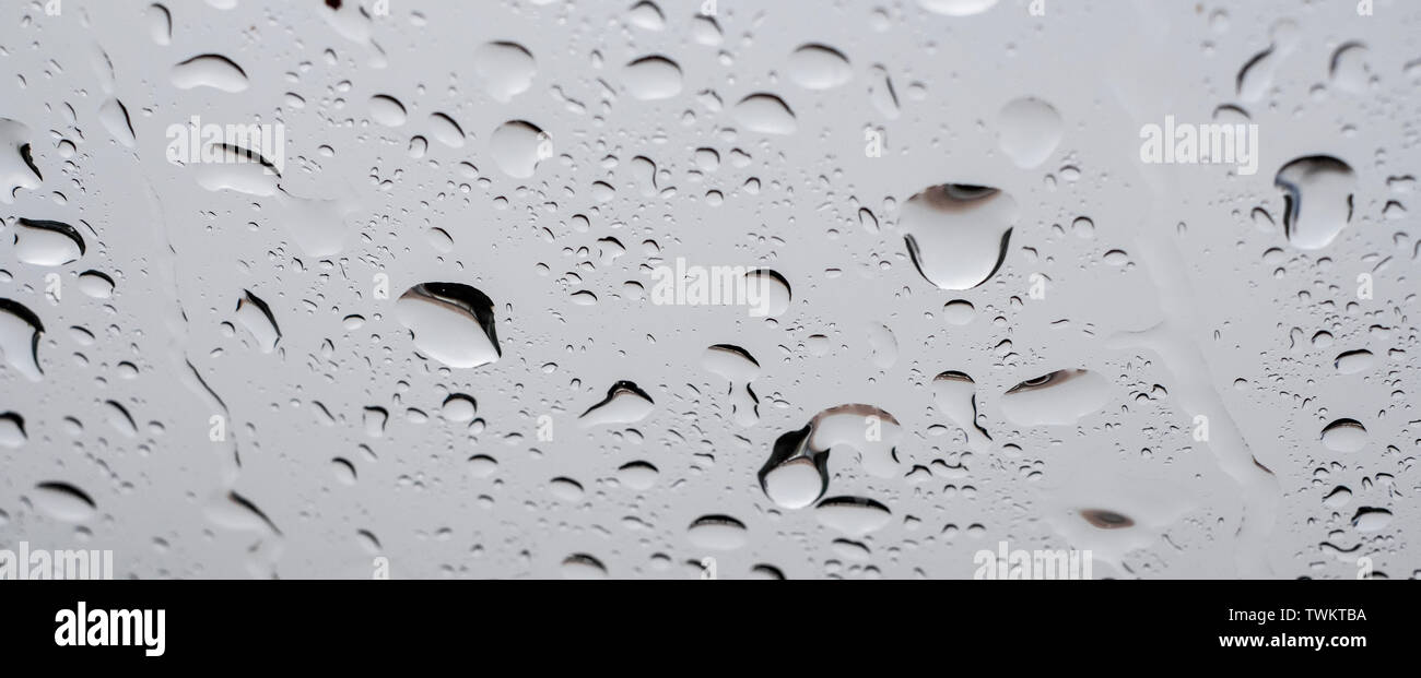 Picture Inside water rain drops on car window glass Stock Photo