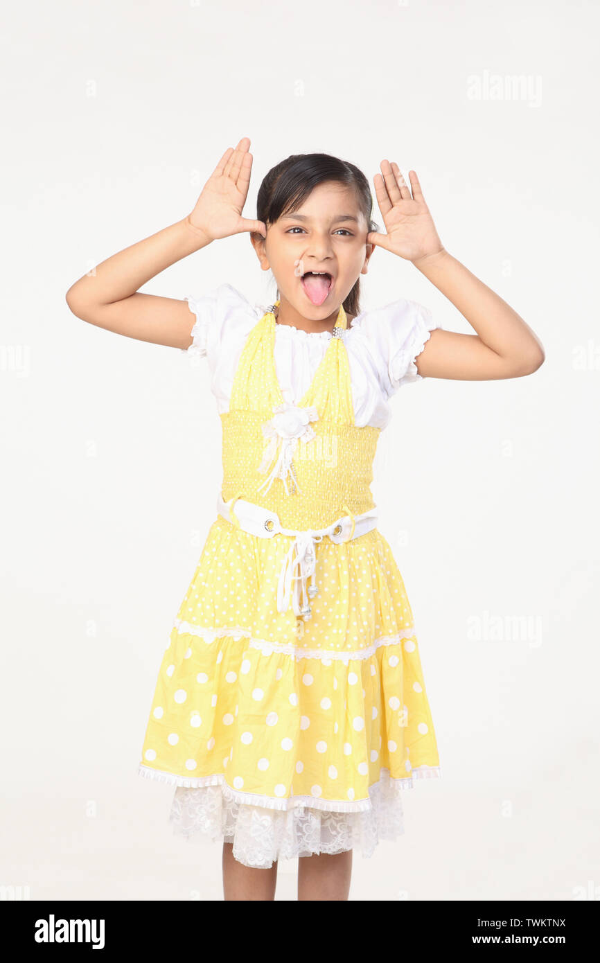 Girl pulling funny faces Stock Photo Alamy