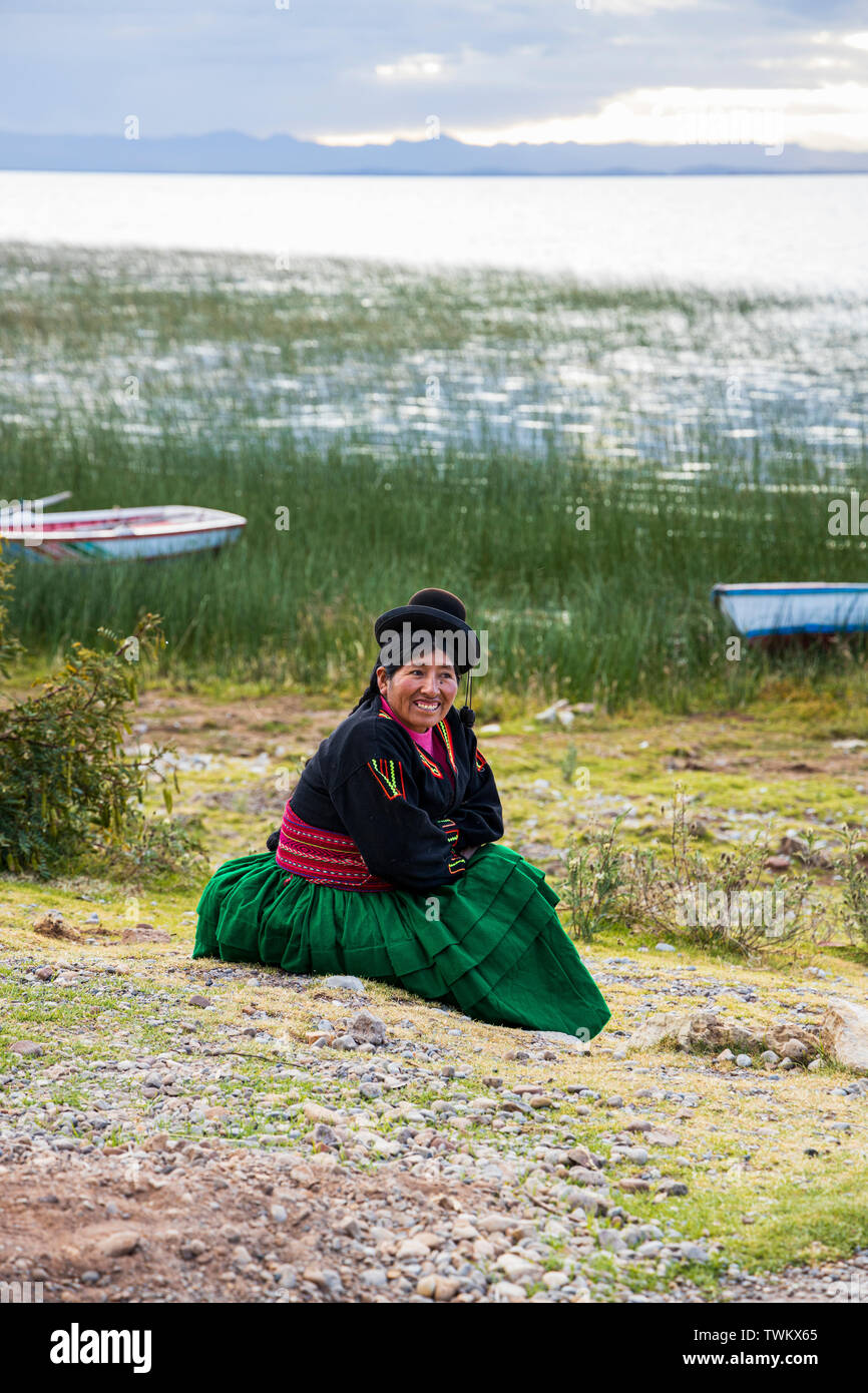 Local people in traditional dress on Luquina Chico, Lake Titicaca, Peru, South America Stock Photo