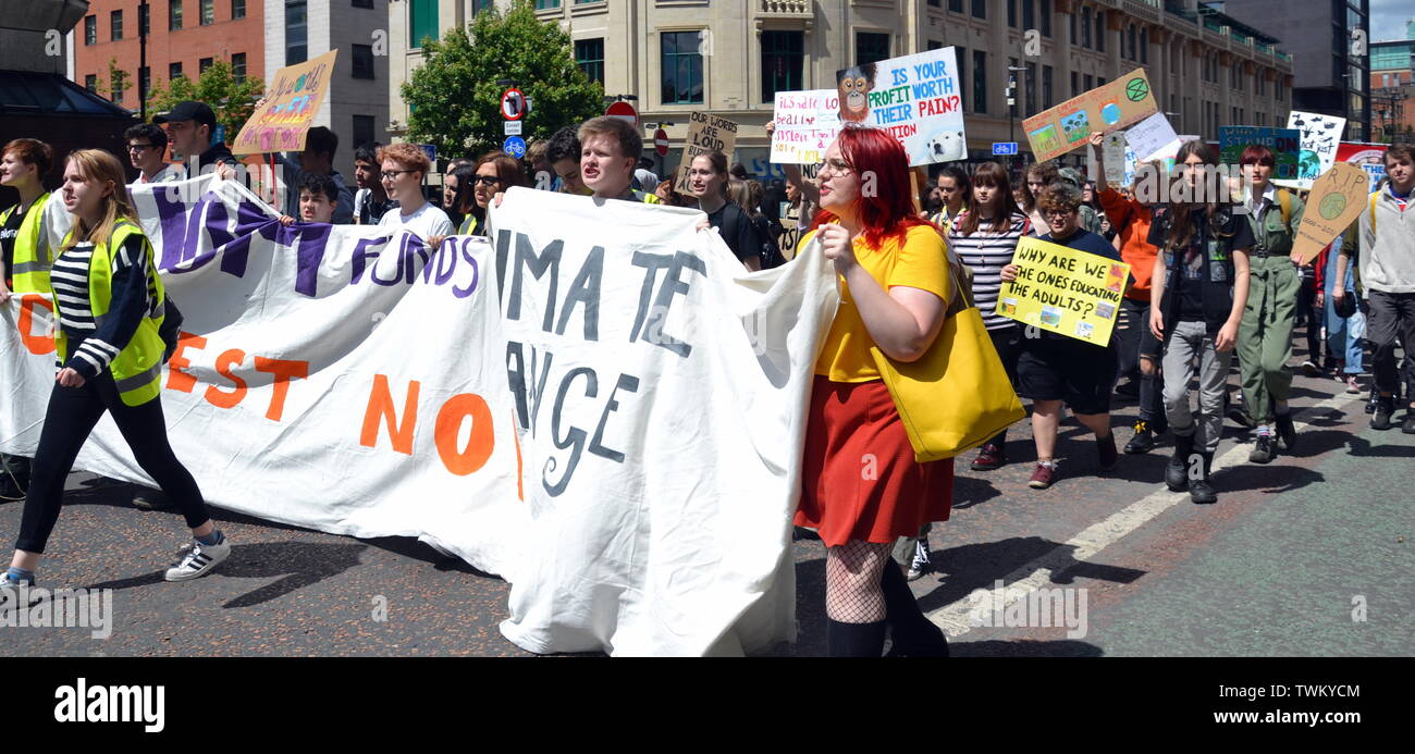 Young people lobby for action to prevent climate change at the  Manchester Youth Strike 4 Climate protest on June 21, 2019, in Manchester, uk. The group marched from St Peter's Square in the city centre to the University of Manchester. One of their demands is for the University to divest itself of investments in fossil fuels. Stock Photo