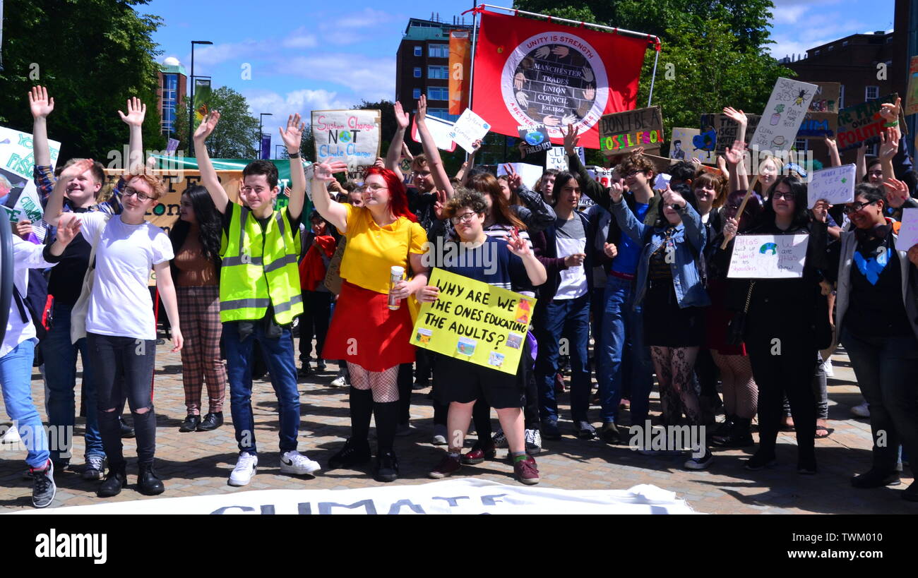 Young people lobby for action to prevent climate change at the  Manchester Youth Strike 4 Climate protest on June 21, 2019, in Manchester, UK. The group marched from St Peter's Square in the city centre to the University of Manchester. One of their demands is for the University to divest itself of investments in fossil fuels. Stock Photo