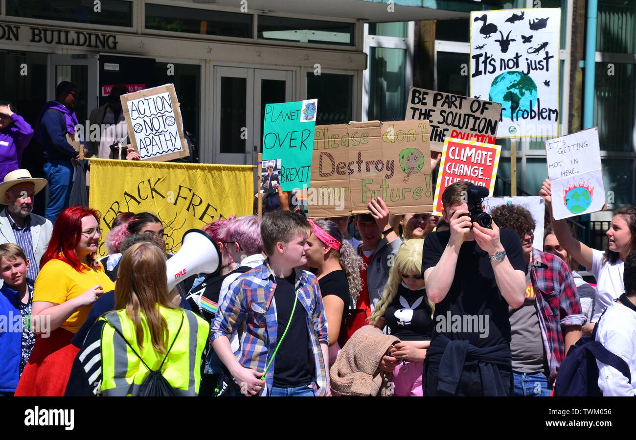 Young people lobby for action to prevent climate change at the  Manchester Youth Strike 4 Climate protest on June 21, 2019, in Manchester, uk. The group marched from St Peter's Square in the city centre to the University of Manchester. One of their demands is for the University to divest itself of investments in fossil fuels. Stock Photo