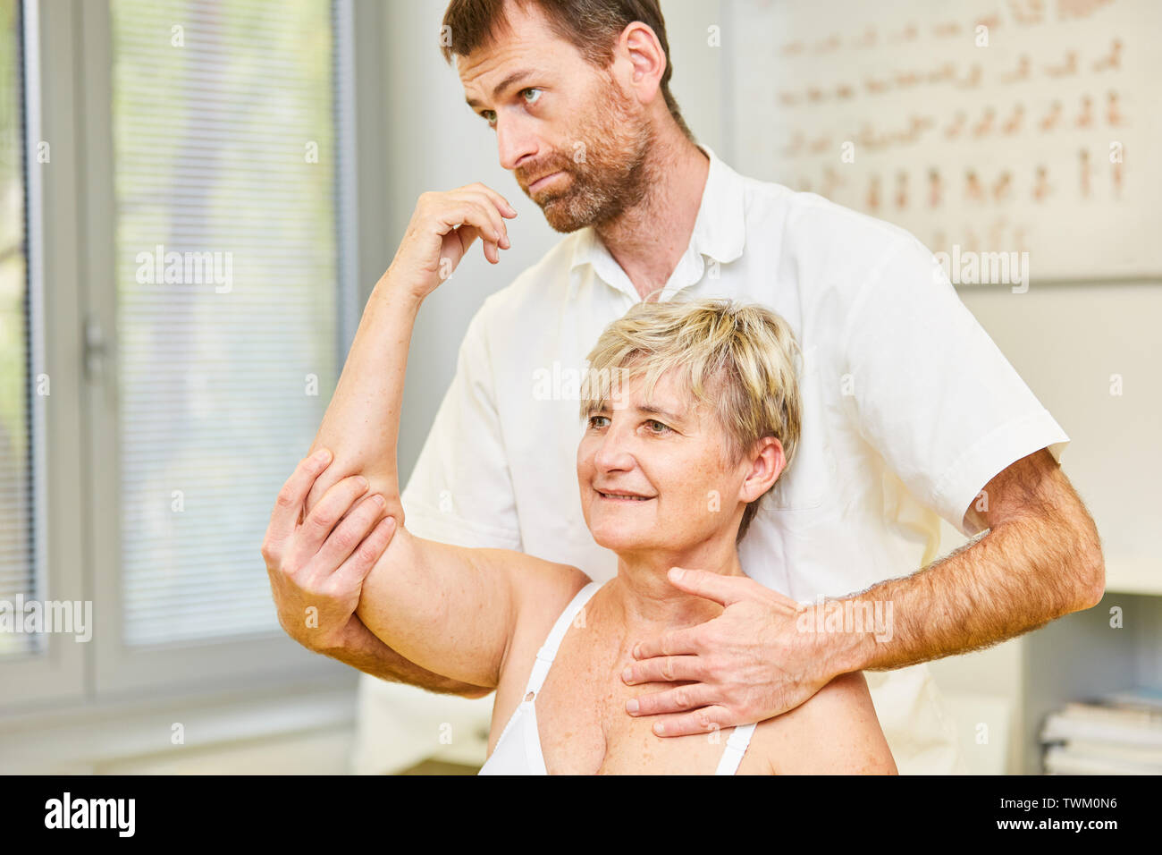 Alternative practitioner treats patient with myoreflex therapy in physiotherapy Stock Photo
