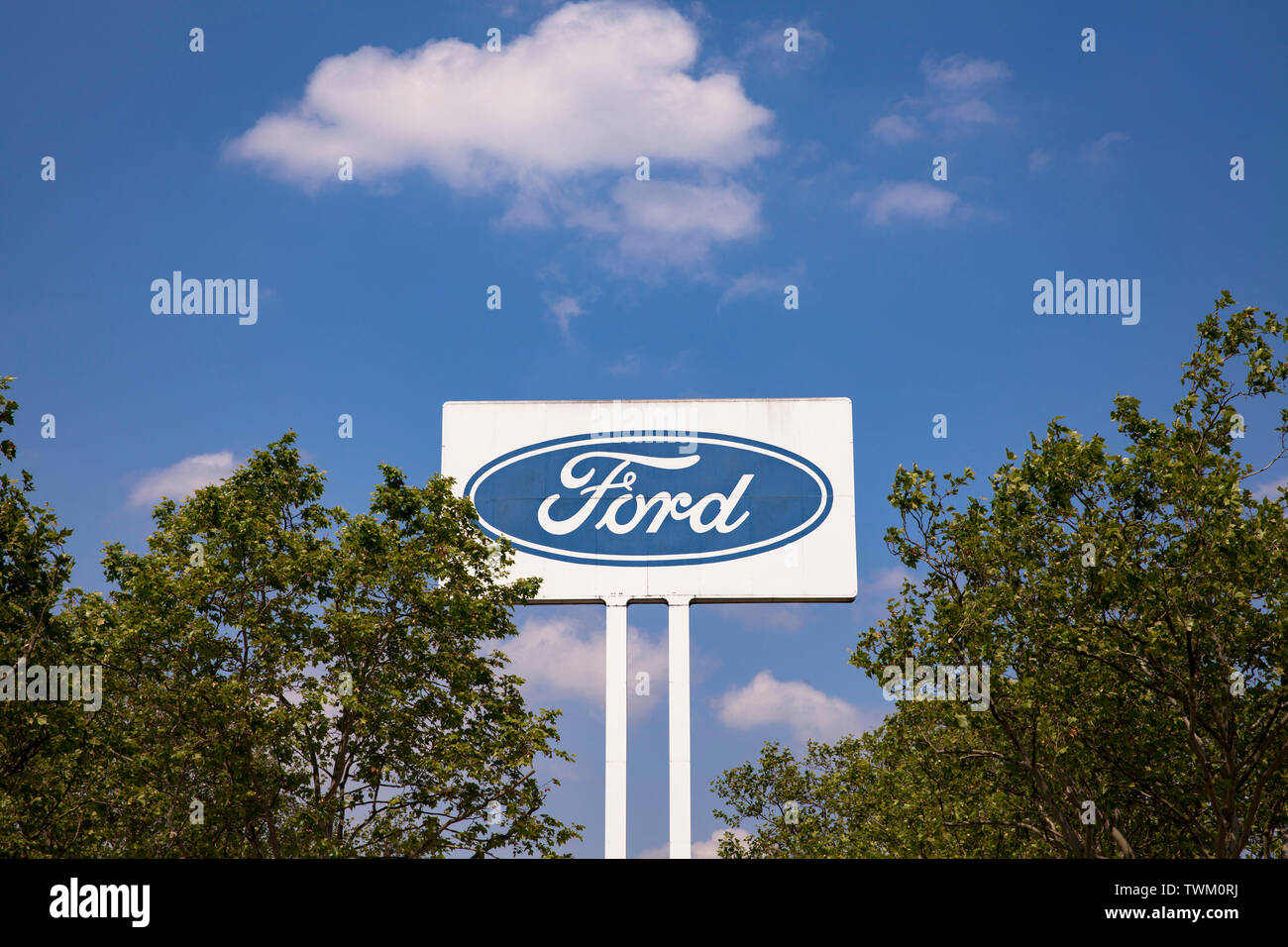 large advertising sign at the Ford automobile factory in the town district Niehl, Cologne, Germany.  grosses Werbeschild an den Ford-Werken in Niehl, Stock Photo