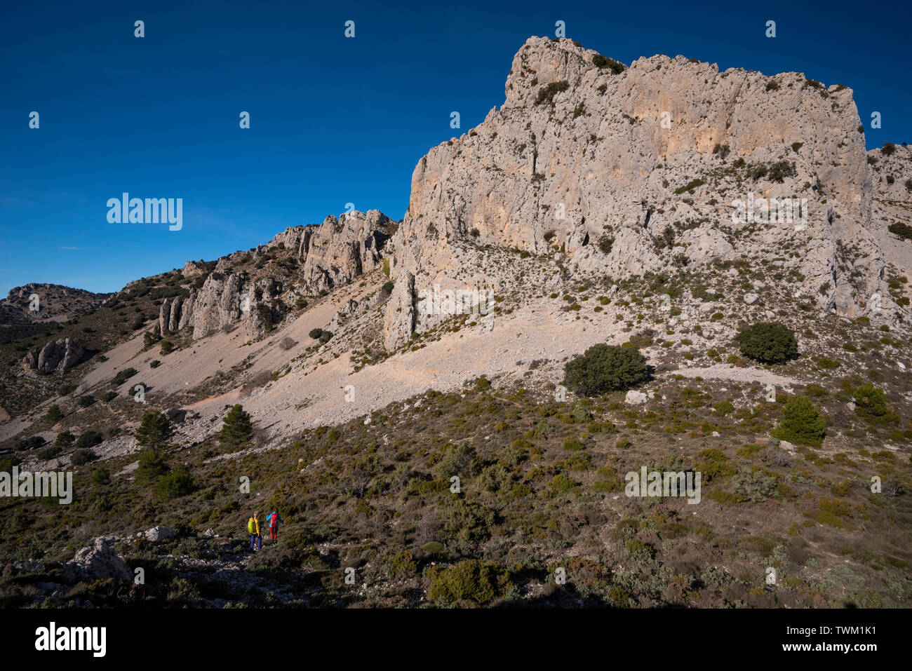 Two women hiking in Sierra de Serrella, Quatretondeta-Confrides, Alicante province, Comunidad Valenciana region, Spain Stock Photo