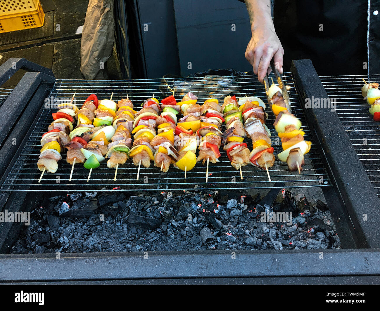 Cooking shish kabob on an outdoor grill in Old Town Square, Prague Czech Republic Stock Photo