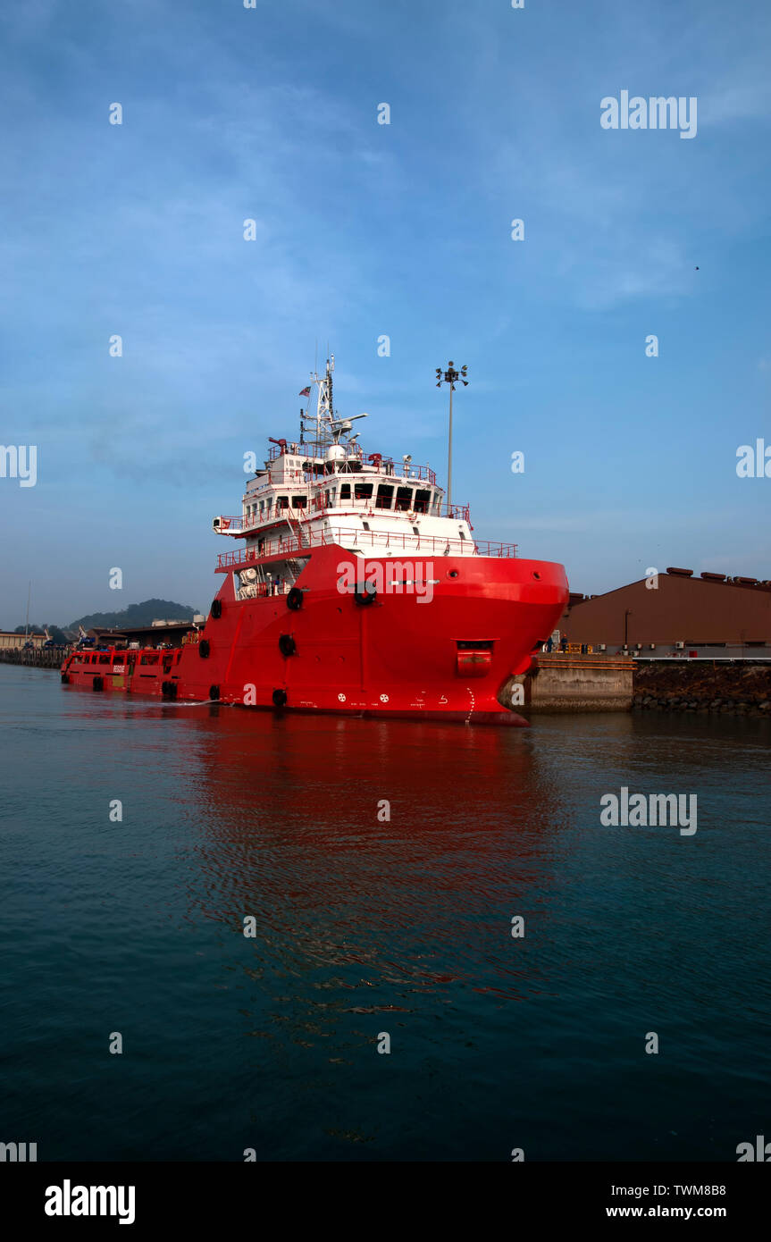 offshore vessel berthing at port with beautiful blue sky Stock Photo