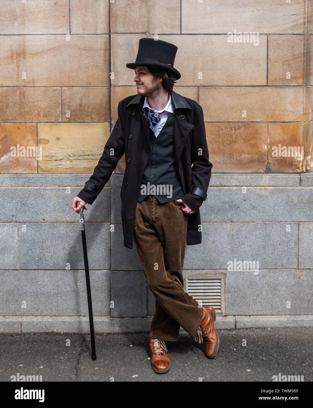 Glasgow Scotland Uk 21st June 2019 Uk Weather A Young Man Called Ian Dressed As A Victorian Gentleman With A Top Hat A Great Coat And Waistcoat And Carrying A Silver Tipped