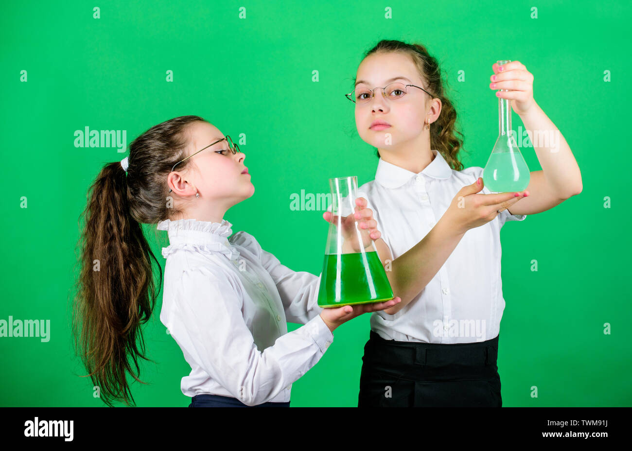 children study chemistry lab. back to school. biology education. little smart girls with testing flask. school kid scientist studying science. Bright minds at work. laboratory work. school work place. Stock Photo
