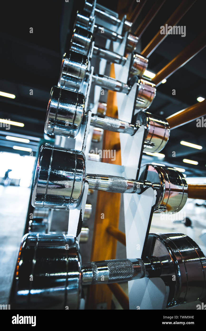 Gym and dumbbell weight training equipment on sport Stock Photo Alamy