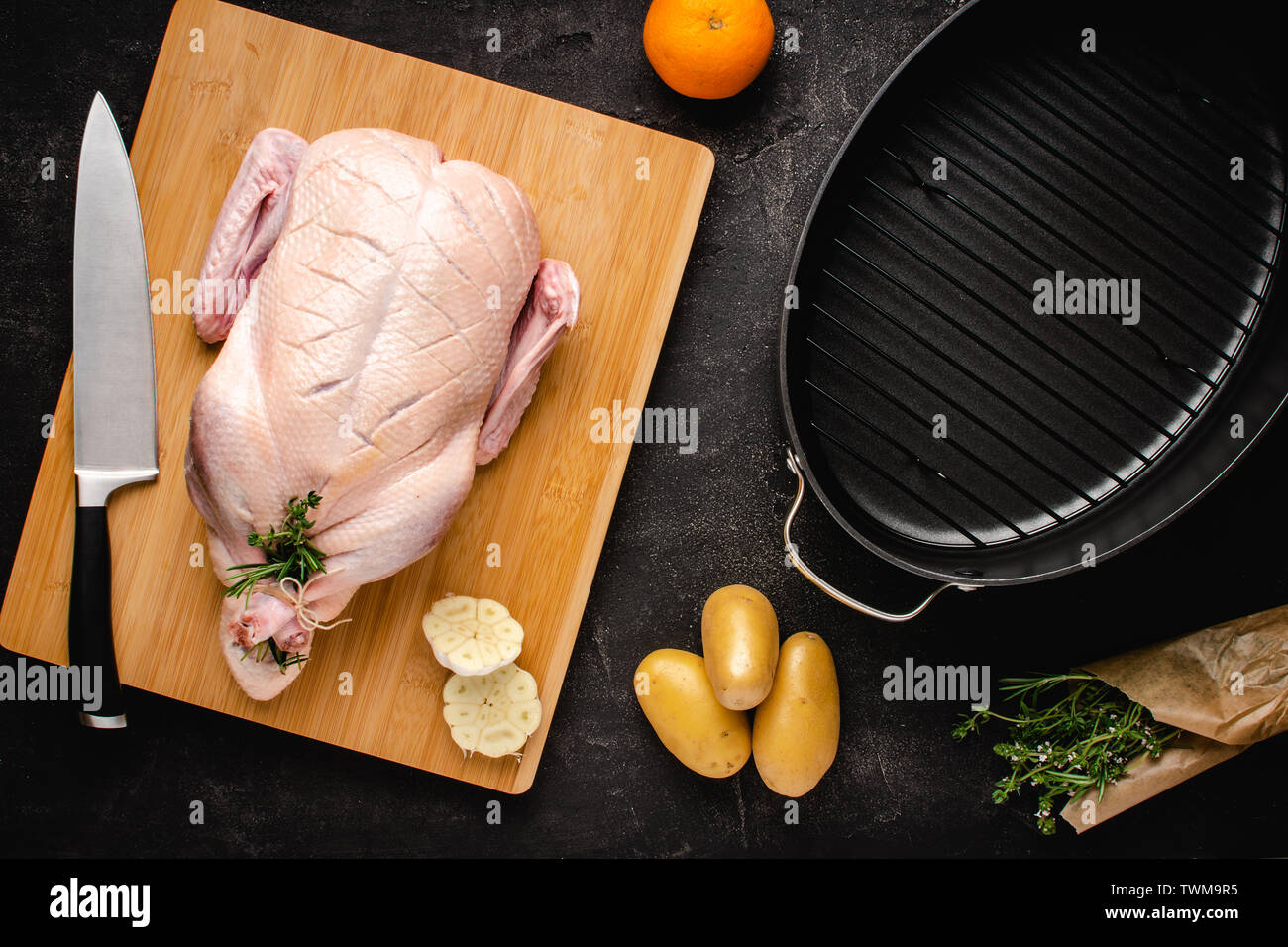 Whole Duck Fresh and Raw on Chopping Board with Ingredients Ready to Cook. Recipe Preparation Concept. Stock Photo