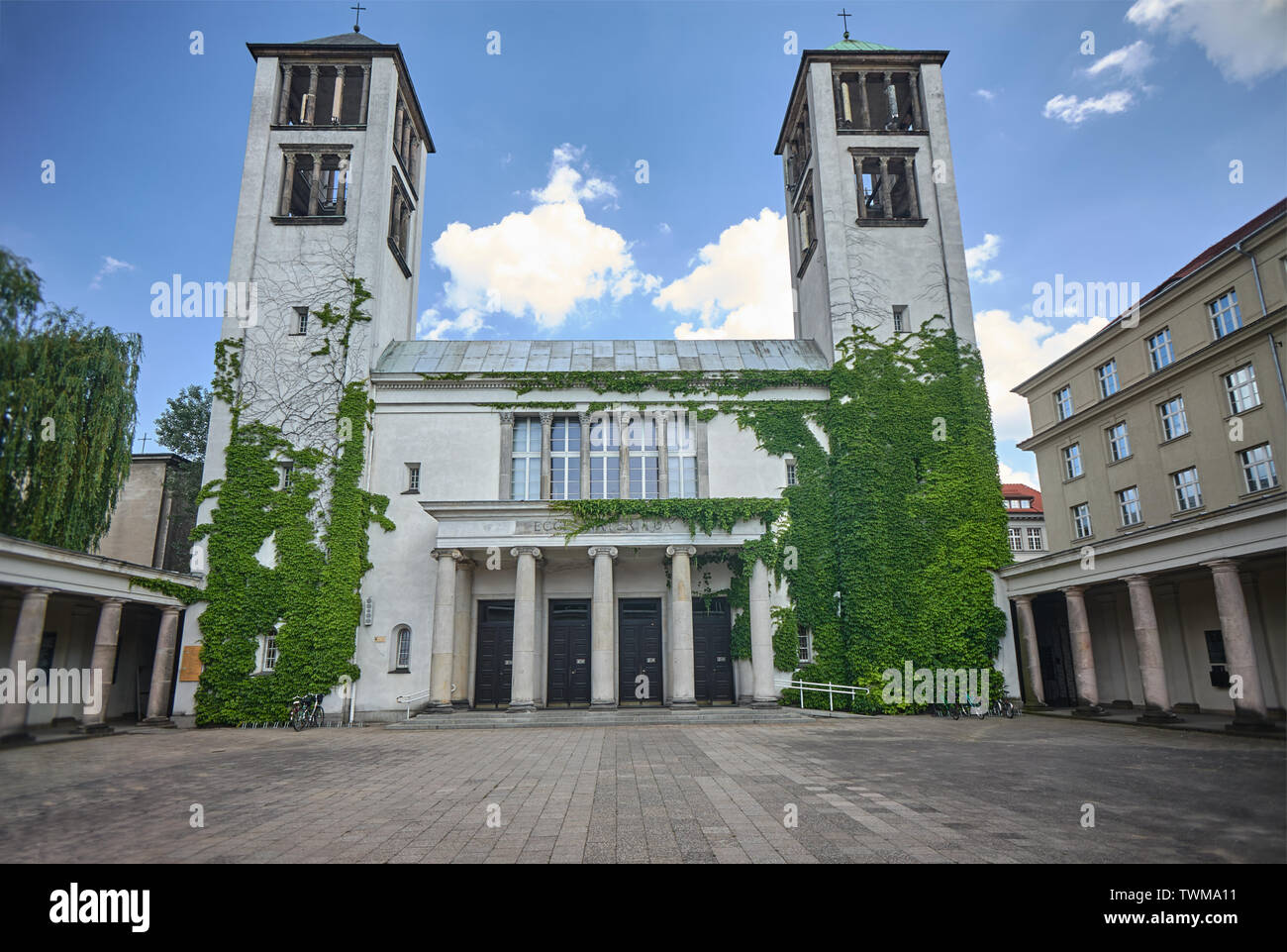 Eclectic facade of the Catholic temple with two towers in Poznan Stock Photo