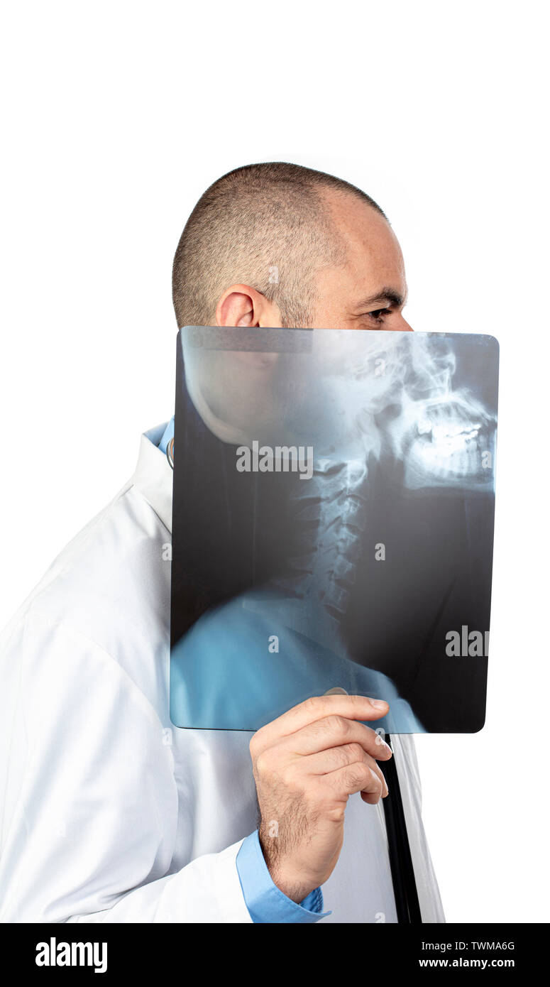 Funny portrait of a young doctor playing with a skull x-ray. isolated on white. Stock Photo