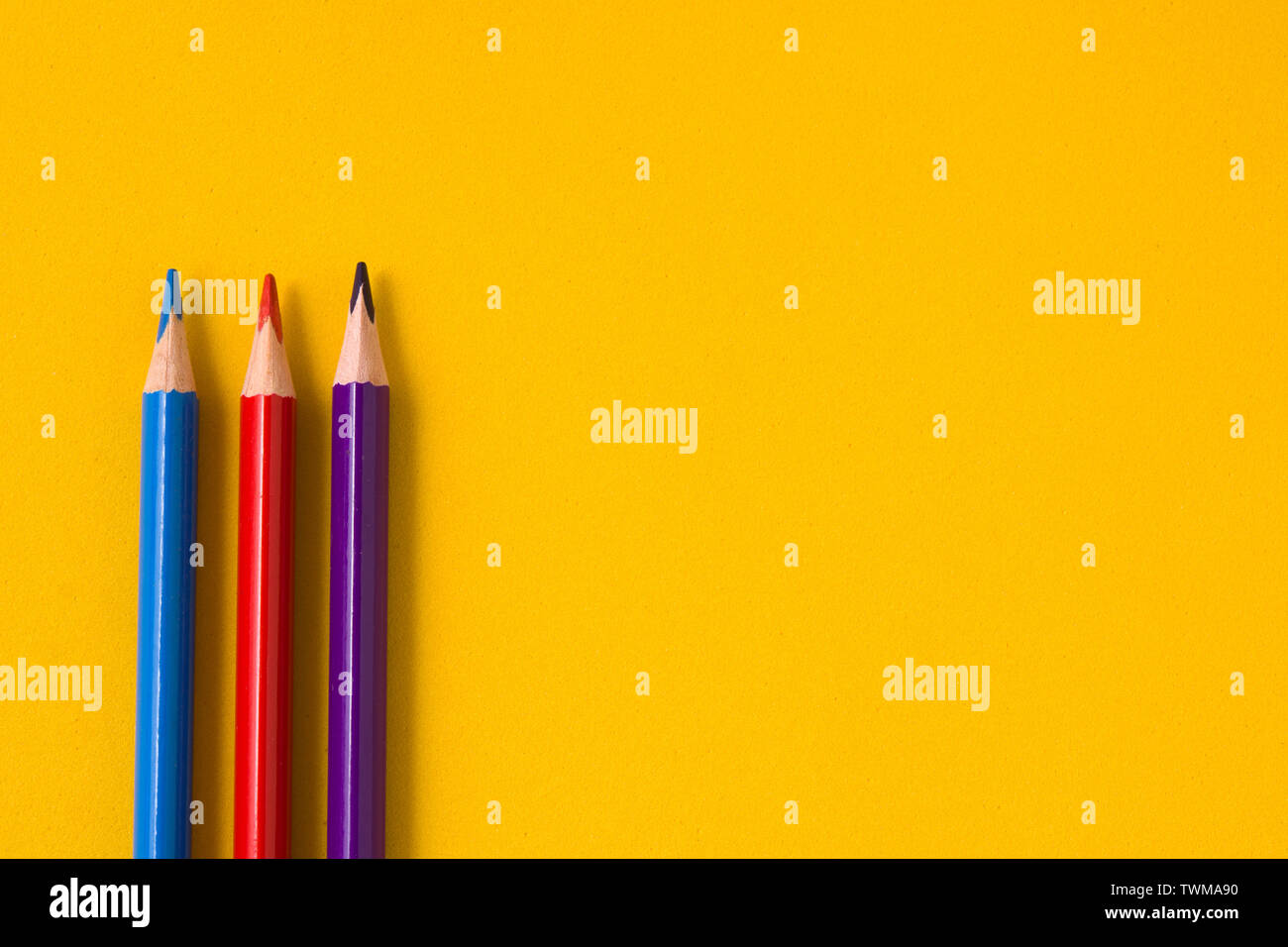 Color pencils on yellow background. Copyspace Stock Photo