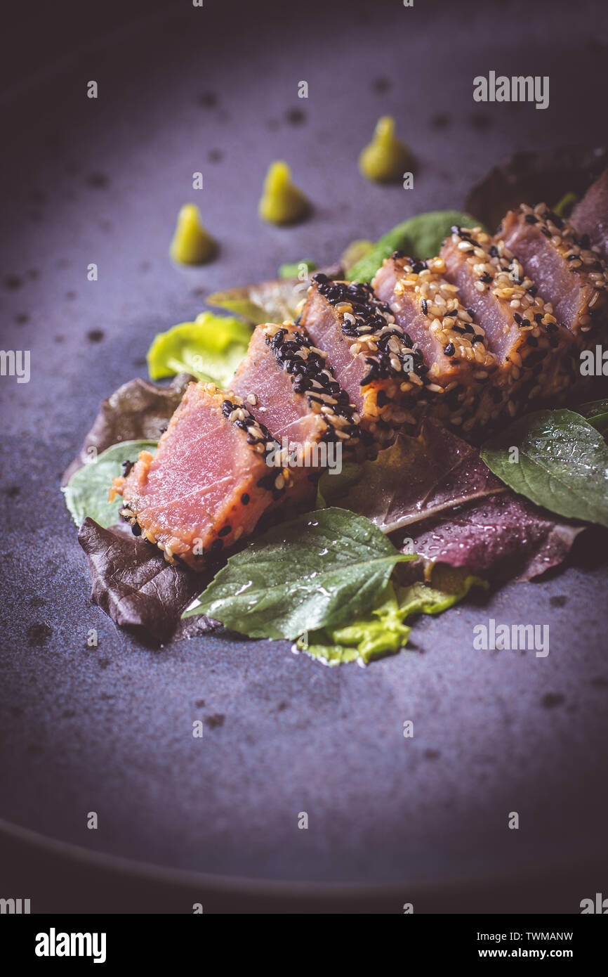 Grilled Tuna Steak with Salad and Hot Wasabi Sauce Stock Photo