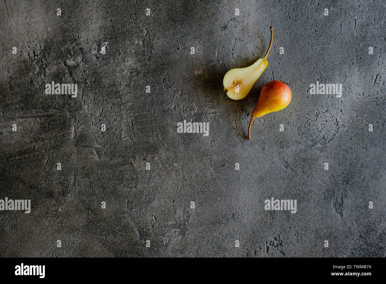 Fresh Organic Pear on Dark Background with Copy Space. Healthy Food Benefits. Stock Photo