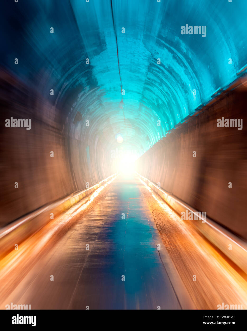 Tunnel with bright light at the exit Stock Photo
